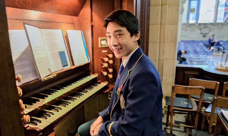  Simon Cheung at the school chapel's 1906 Walker organ