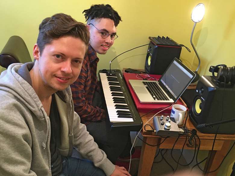  Alex (left) provides convenient music technology education for students like Josh (right)