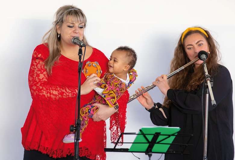  Musician Pip performing with mother and baby at the Museum of Liverpool