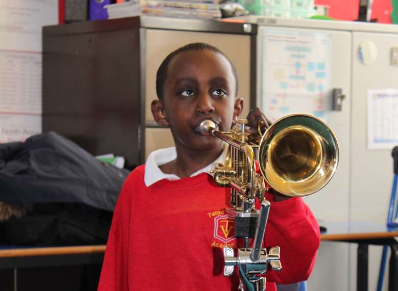  A student using the Trumpet Adapter