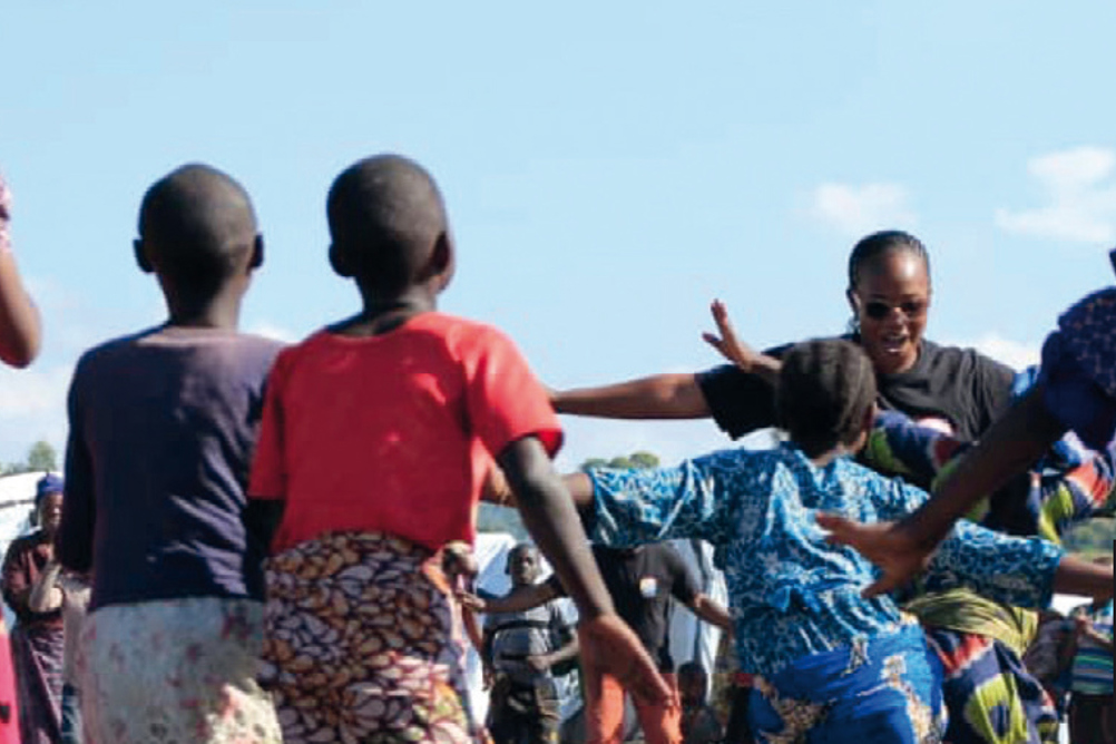Even the austere conditions of a camp for Internally Displaced People can't prevent children finding pleasure in singing and dancing