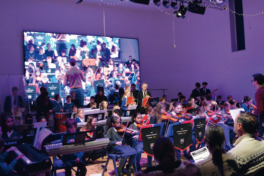 Winston Churchill School director of music Chris Drake leads students from the school and from local primaries in the Primary Orchestra Concert in November